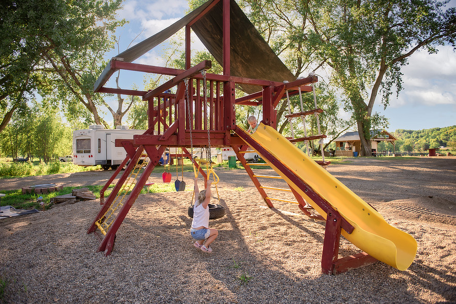 Swinging kid on playground
